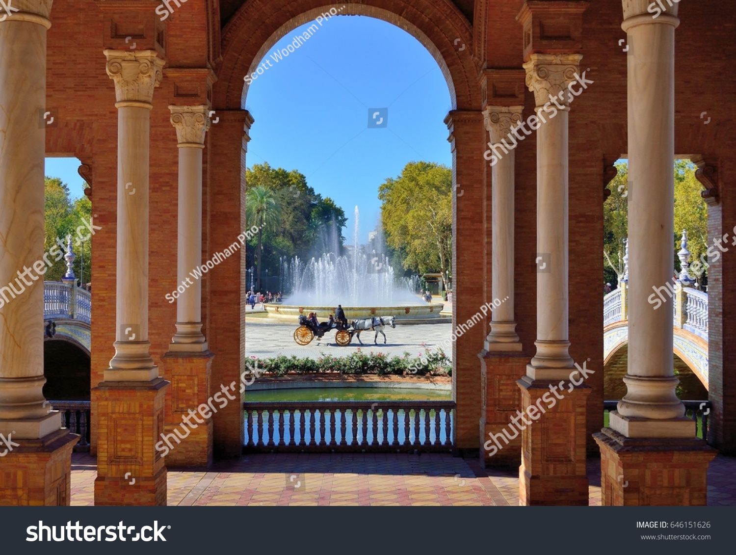Plaza de Espana Seville:
View from main building of fountain horse carriage and Maria Luisa Park.