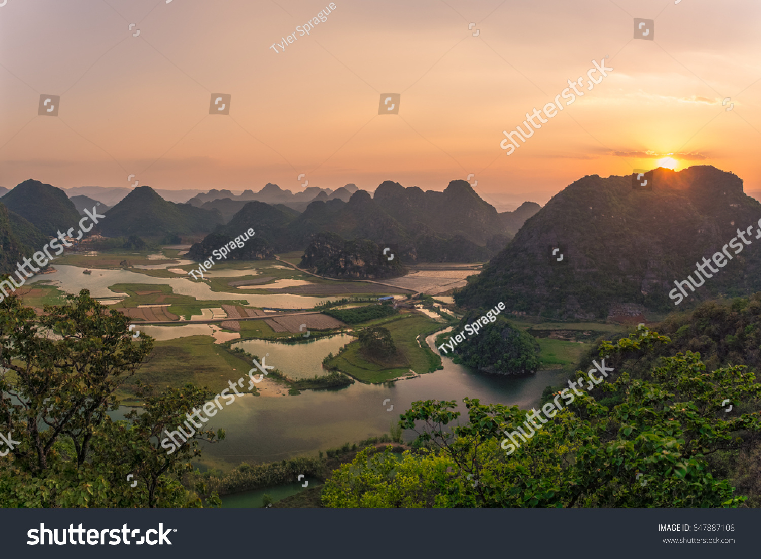 Sunset over the karst mountains near Puzhehei in Yunnan Province  China.