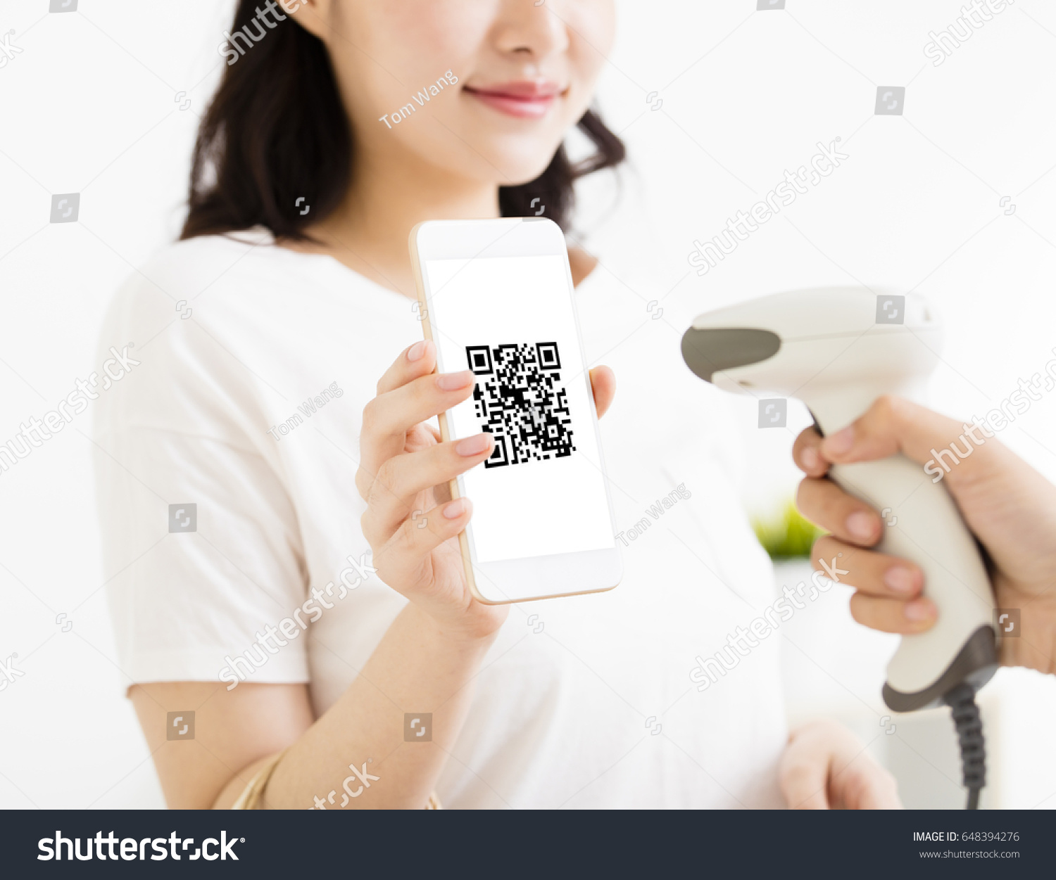 young woman pay by smart phone with qr code