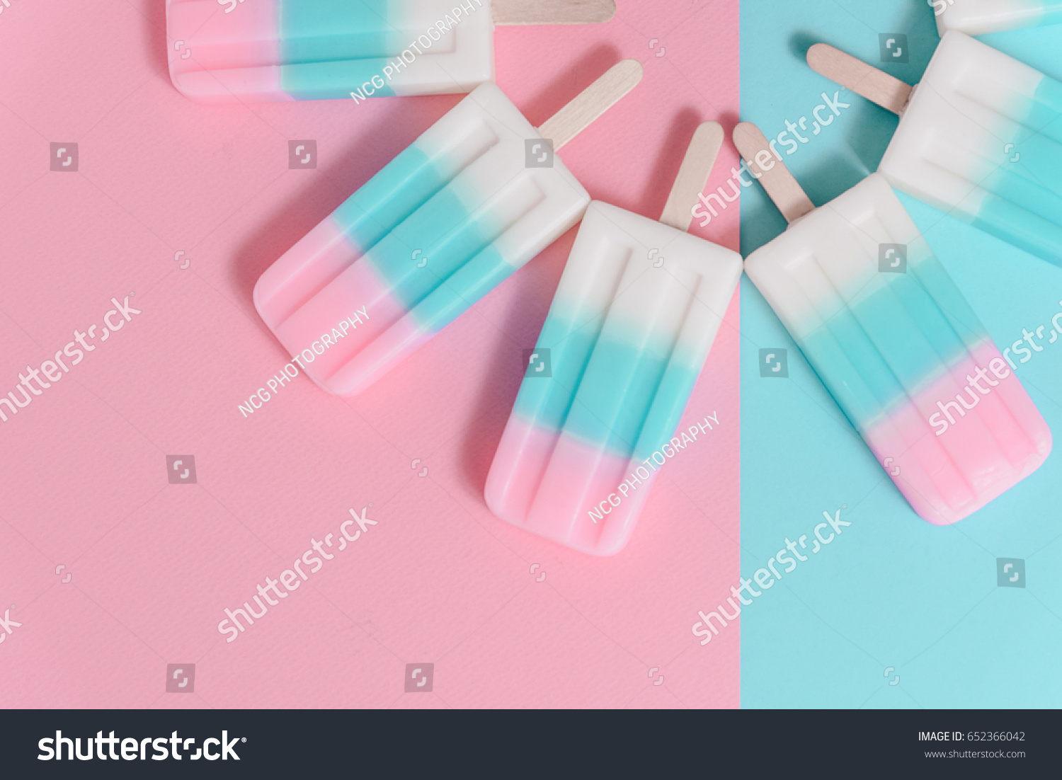Ice cream sticks on pastel colors background