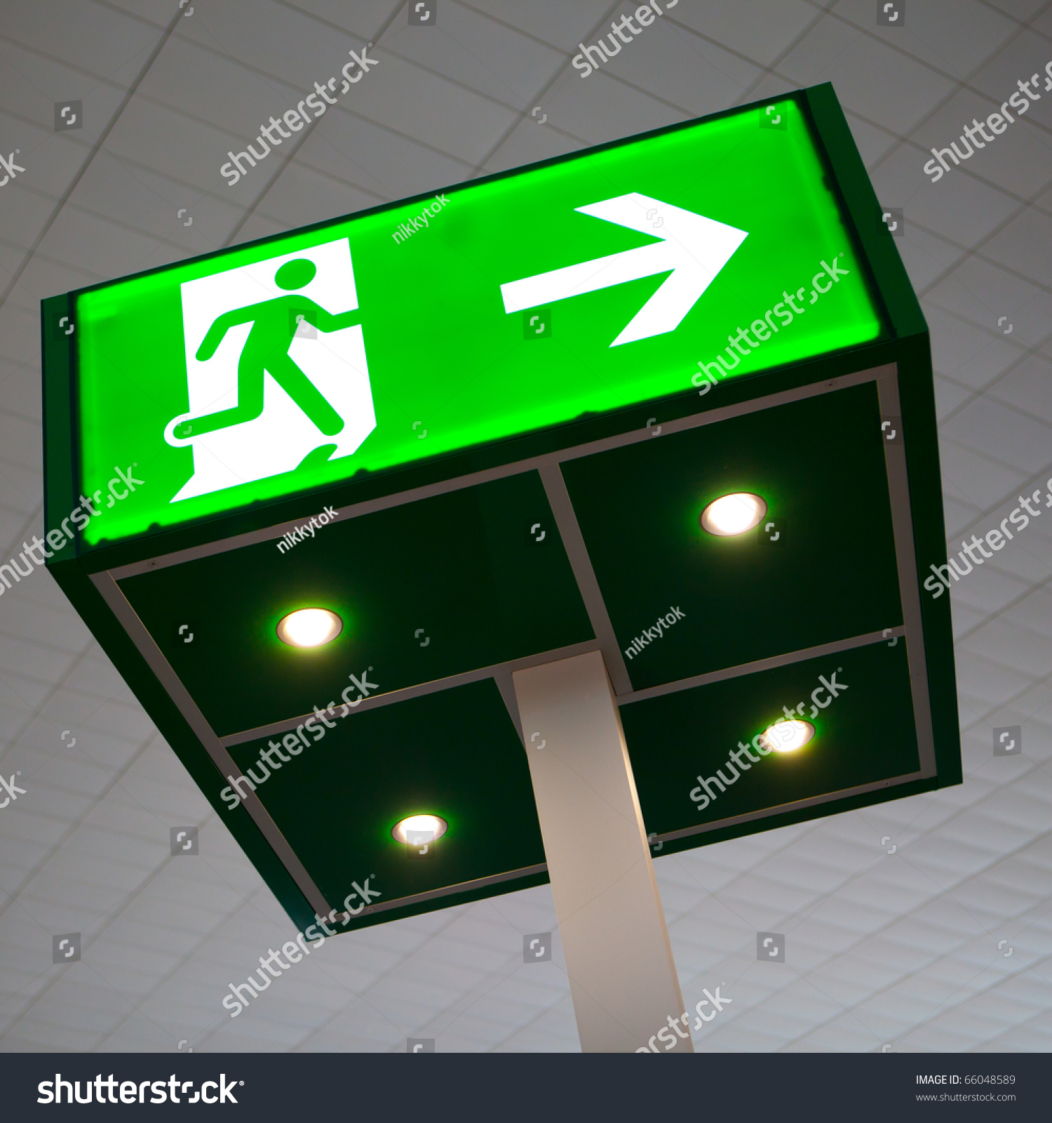 green emergency exit sign