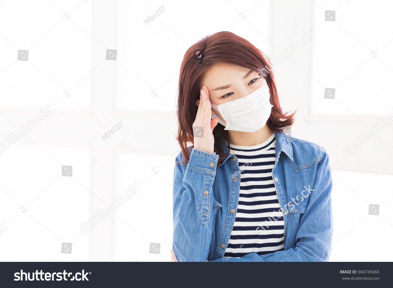 young attractive asian woman who wore a mask