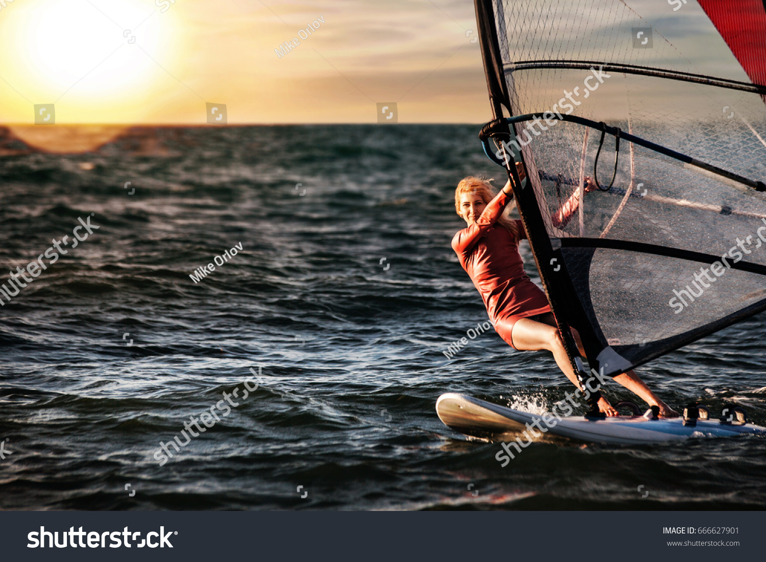 Girl on Windsurfing  Fun in the ocean  Extreme Sport.