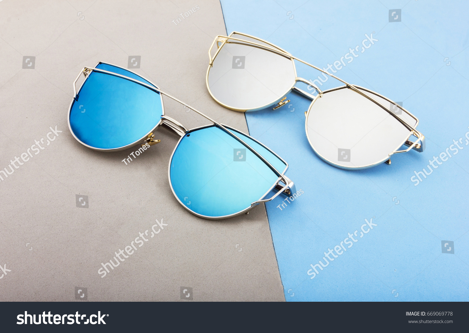 CREATIVE SHOOT OF SUNGLASSES WITH COLORFUL BACKGROUND AND COOL PROPS.