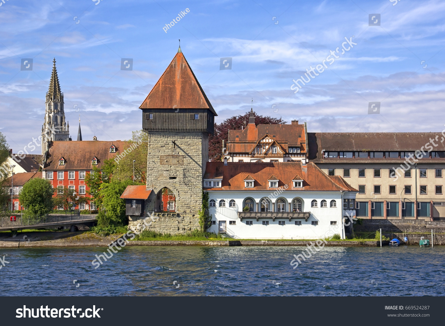 View to the Rheintorturm part of the city wall of Konstanz at Lake Constance. Konstanz is a university city bordering Switzerland. The Rhine river passes through Lake Constance and leaves it.