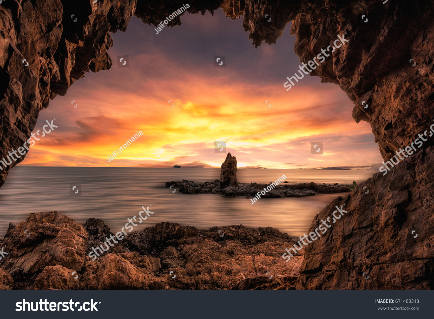 The beautiful rock cave at the sea with sunrise sunset 