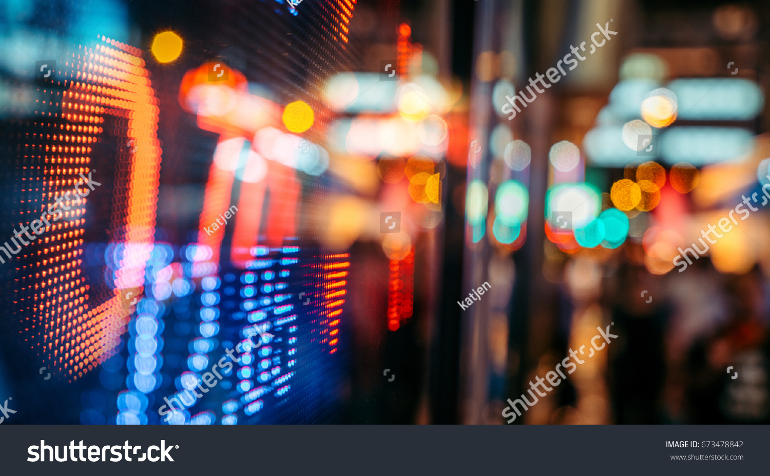 Display of Stock market quotes with city scene reflect on glass