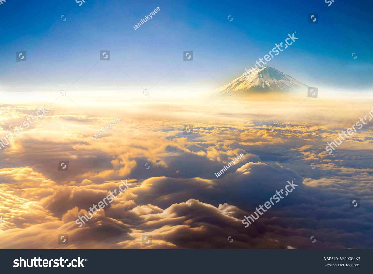 clouds sky skyscape and fuji mountain. view from the window of an airplane flying in the clouds  top view clouds like  the sea of clouds sky background   Aerial view background  Yamanashi  Japan