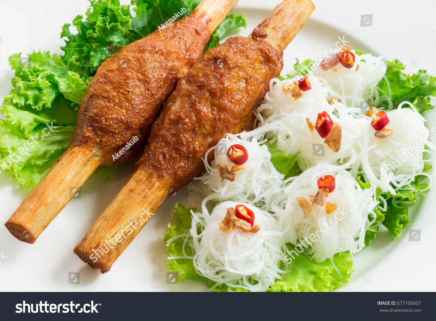Fried Shrimp with Sugar Cane and noodle on top with chili and Fried garlic Vietnamese food recipe. Can use to create menu in the restaurant.