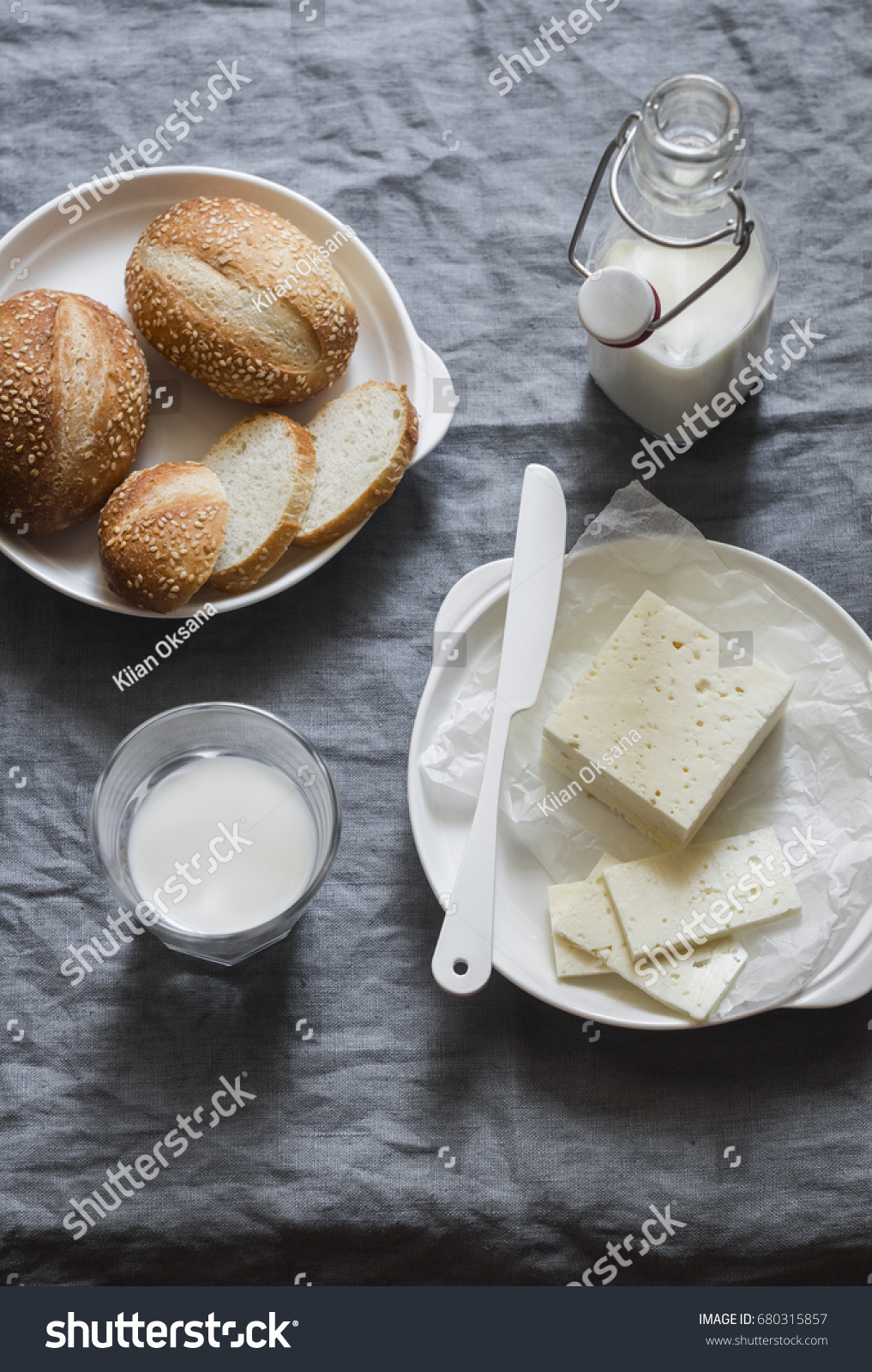 Simple country snake - bread  sheep's cheese and milk on a gray background  top view