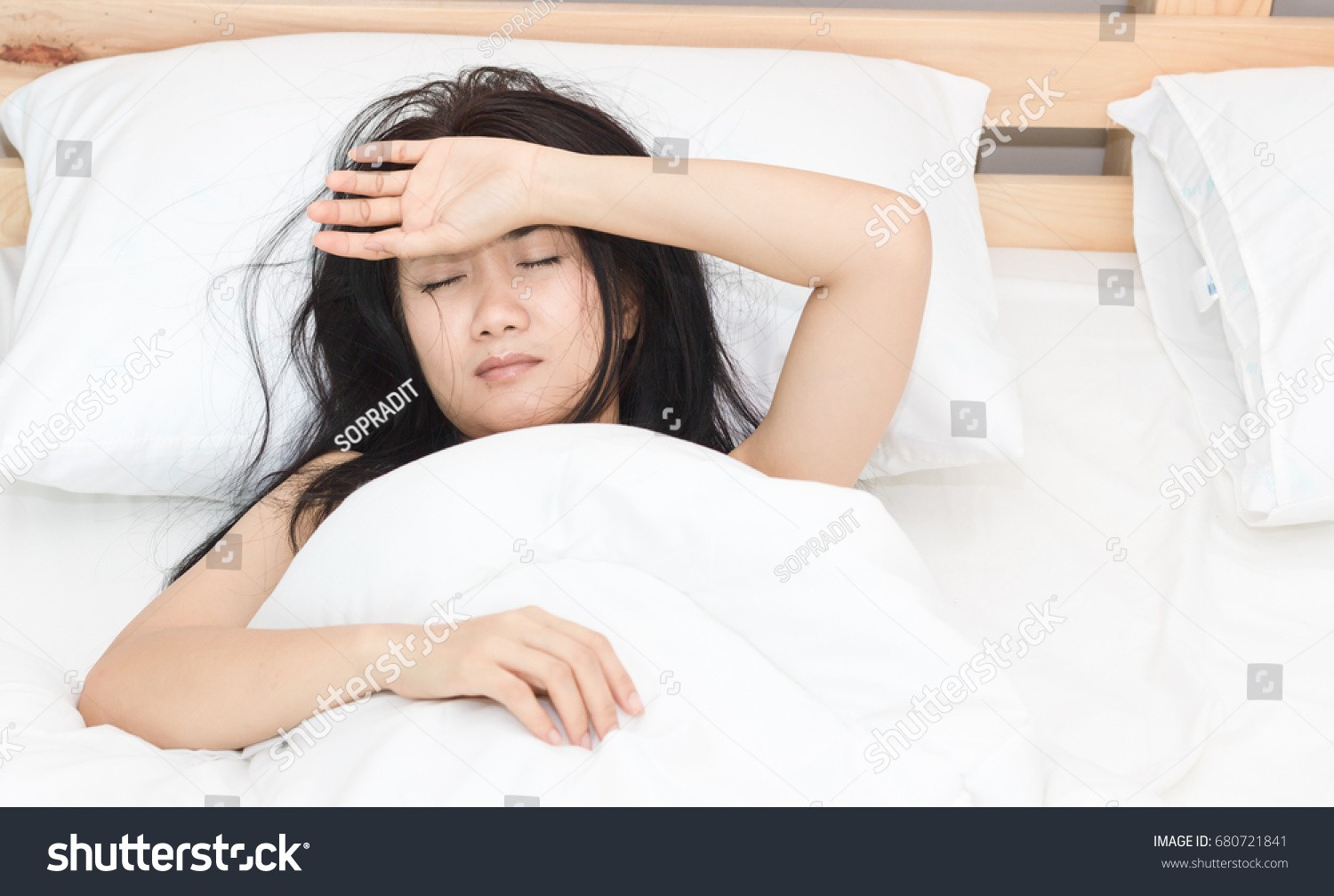 beautiful Asian women sick with sleep on bed