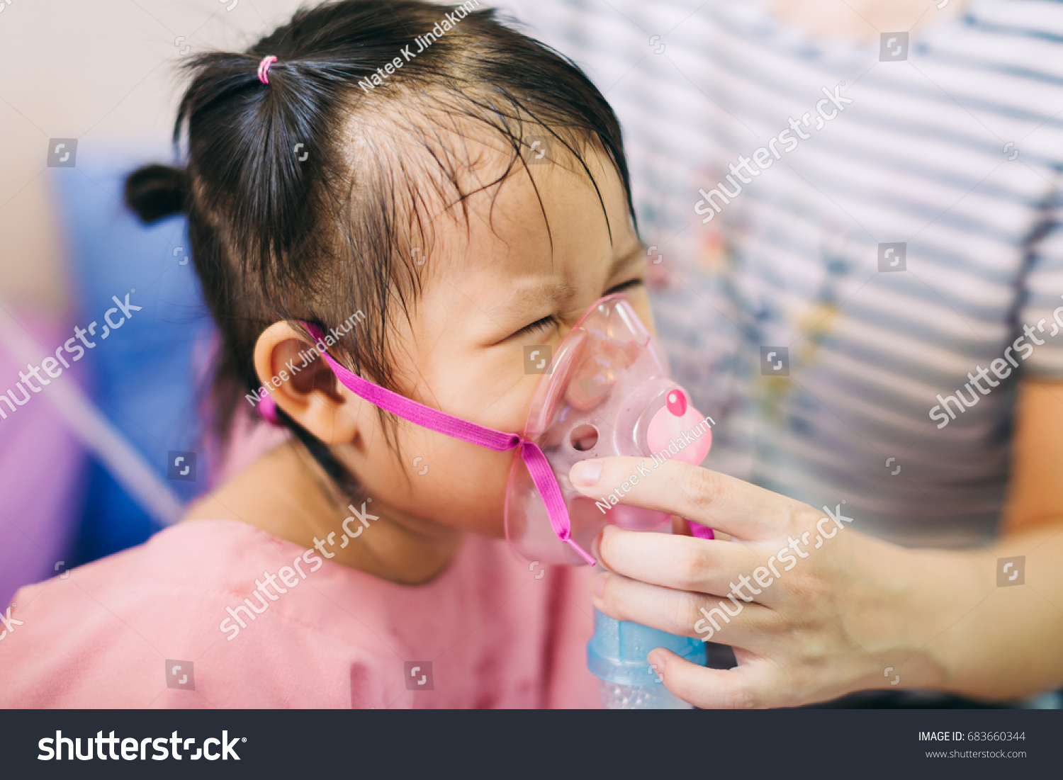 Doctor treatment a child who got sick by a chest infection after a cold or the flu that has trouble breathing and prolonged cough. A symptom of asthma or pneumonia.