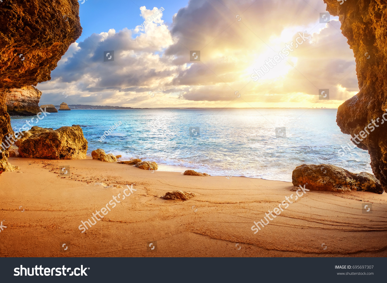 beautiful Atlantic ocean view horizon with sandy beach   rocks and waves. Algarve   Portugal