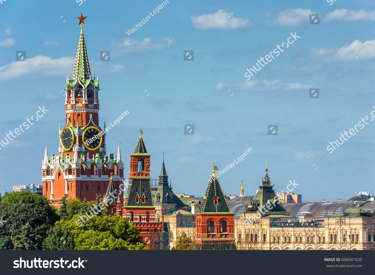 Kremlin with Spasskaya tower Moscow Russia. Kremlin is the residence of Russian president and the main landmark of Russian capital. Ancient Kremlin in the sunlight. Kremlin postcard with copy space.