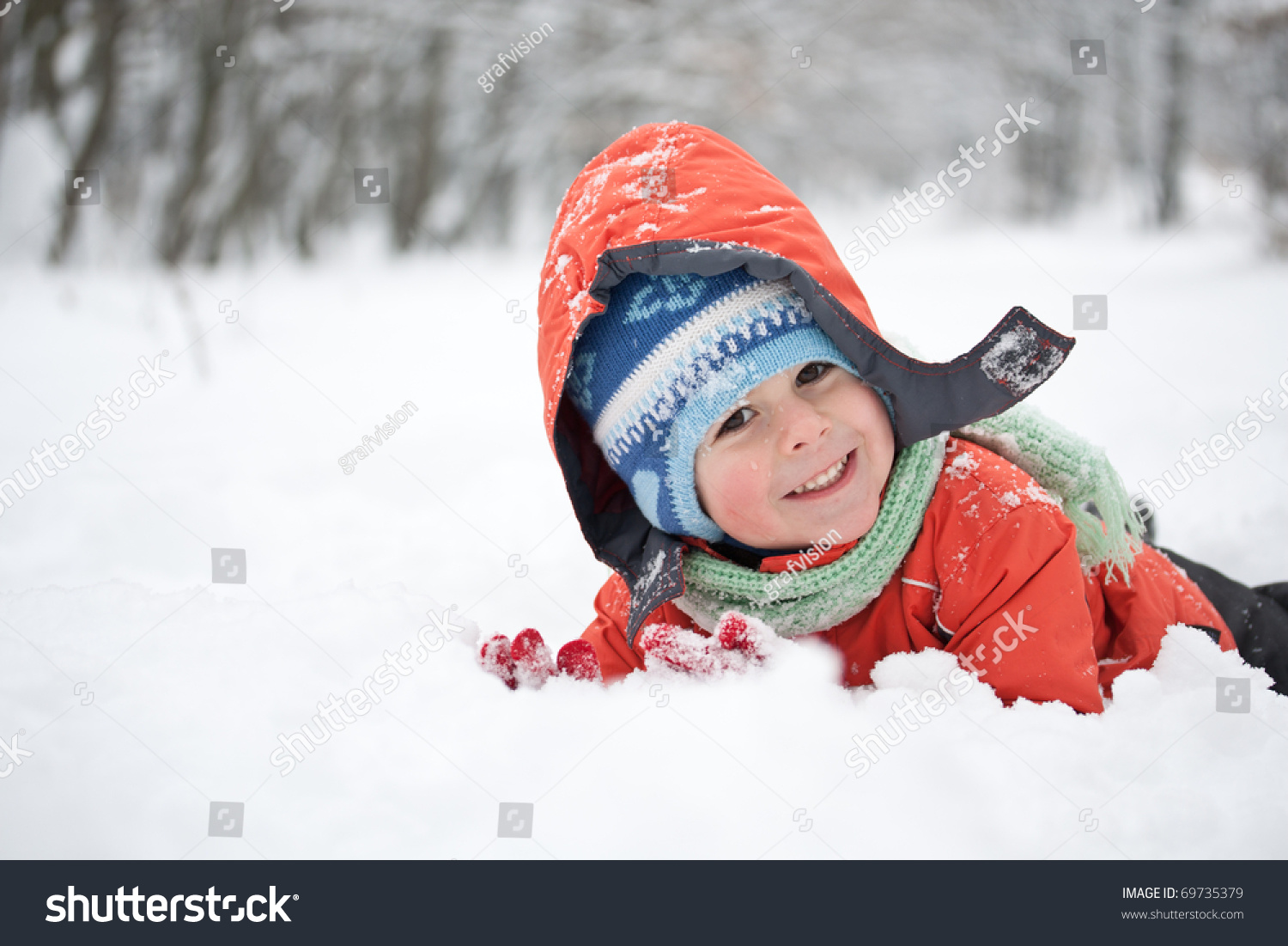 Little boy having fun in the snow