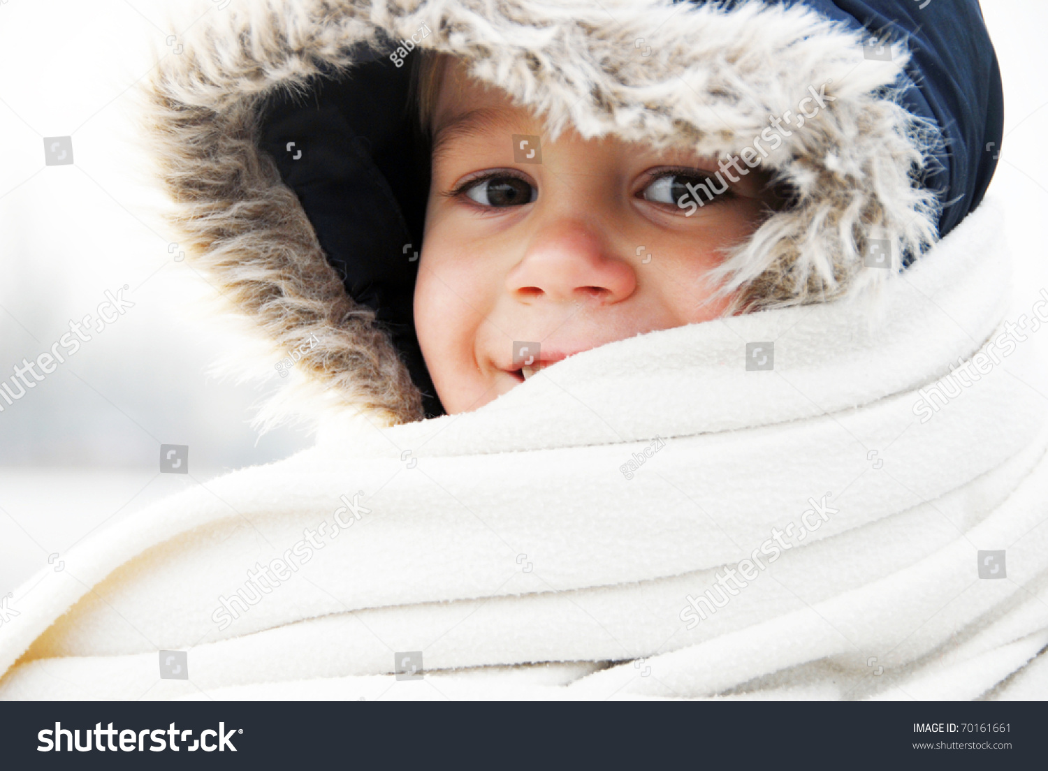 Happy smiling boy in winter clothes