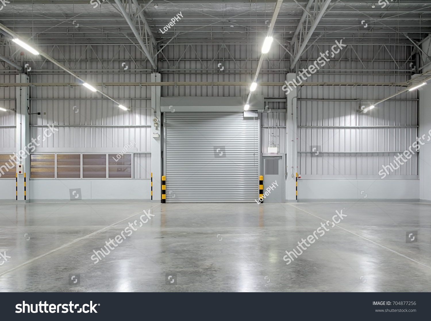 Shutter door or roller door and concrete floor inside factory building for industry background.
