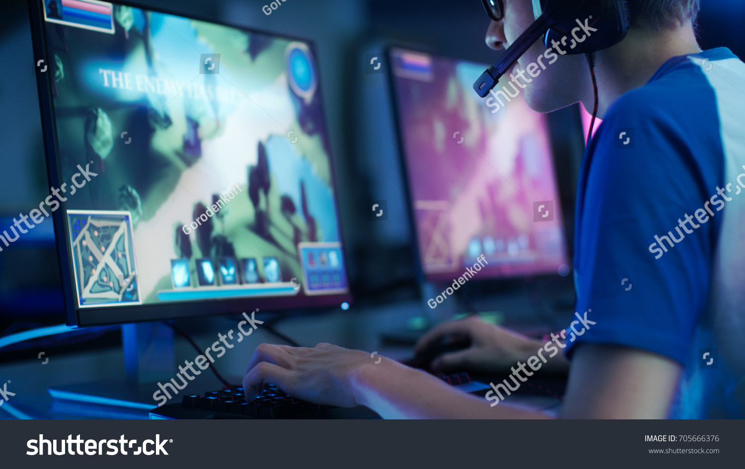 Team of Professional eSport Gamers Playing in Competitive MMORPG/ Strategy Video Game on a Cyber Games Tournament. They Talk to Each other into Microphones. Arena Looks Cool with Neon Lights.