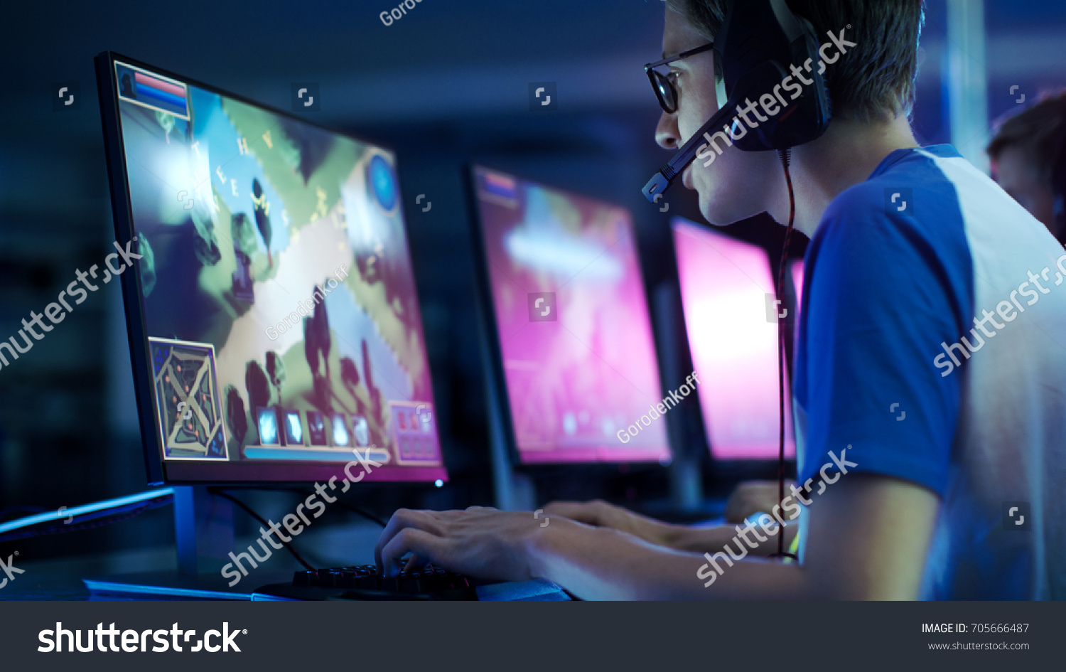 Team of Professional eSport Gamers Playing in Competitive  MMORPG/ Strategy Video Game on a Cyber Games Tournament. They Talk to Each other into Microphones. Arena Looks Cool with Neon Lights.