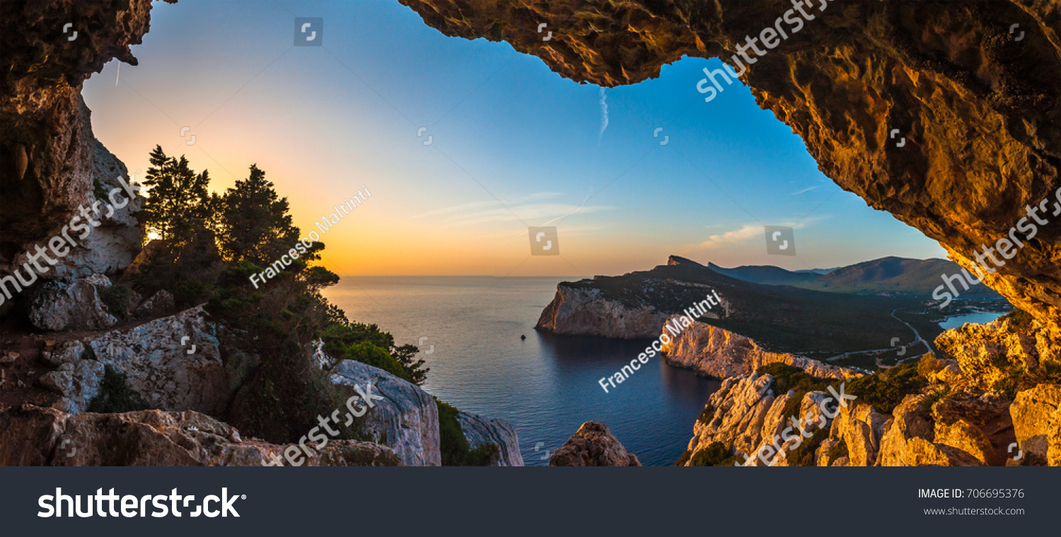 Landscape of the gulf of capo caccia from the Cave of broken vessels at sunset
