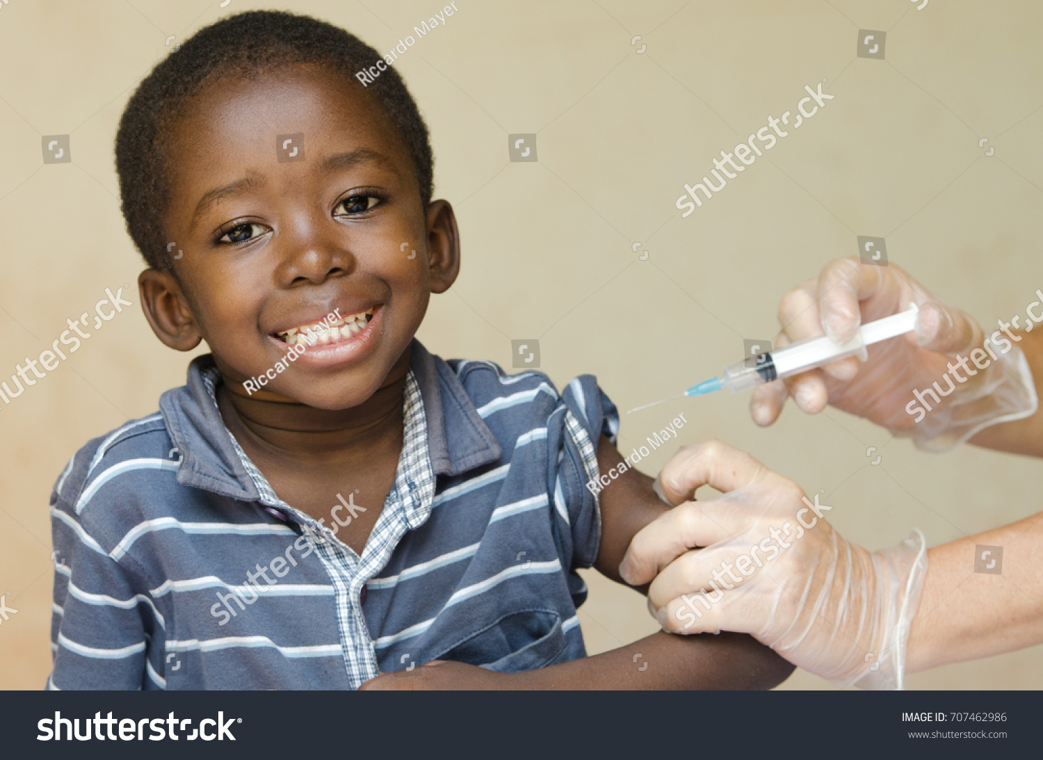 African boy happy about getting a vaccination