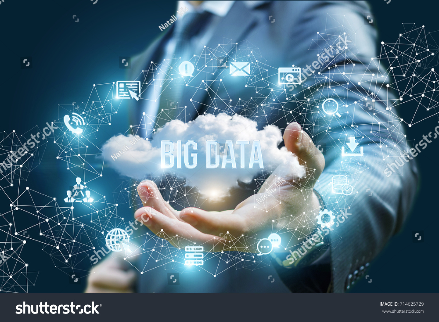 Businessman showing a cloud with the words big data on blue background.