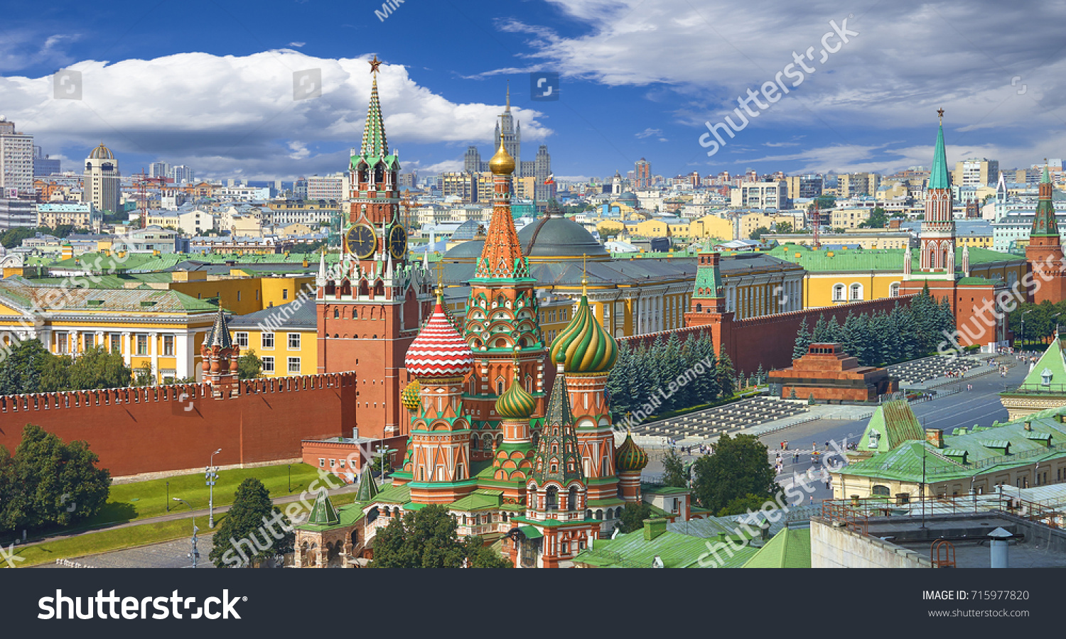 View on Moscow Red Square Kremlin towers Clock Kuranti Saint Basil's Cathedral church Lenin mausoleum. Panorama Hotel Russia. Moscow holidays vacation tours famous sightseeing. Moscow Red Square