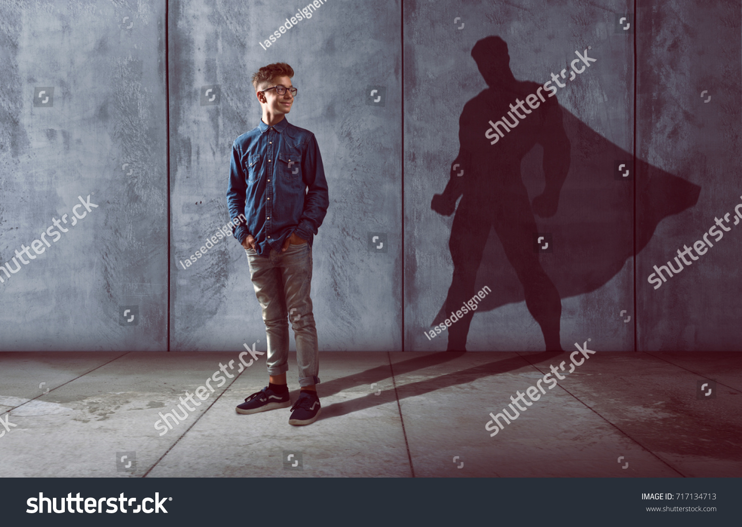 Teenager with superhero shadow