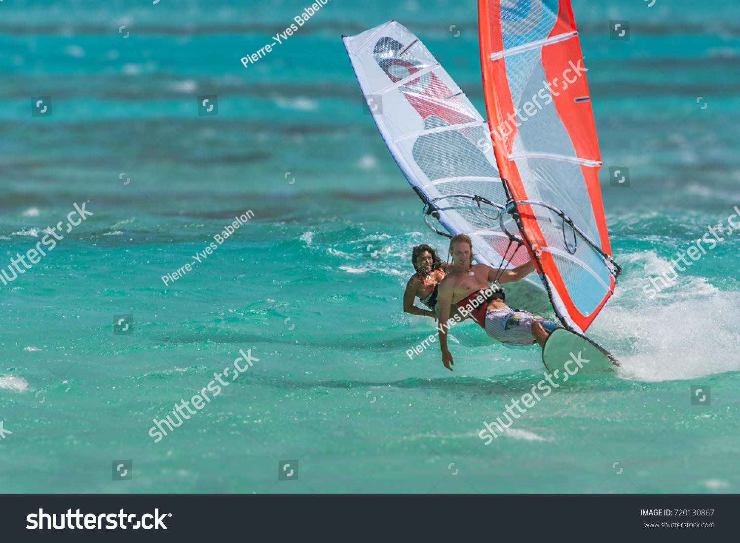 Couple of windsurfers playing in the lagoon