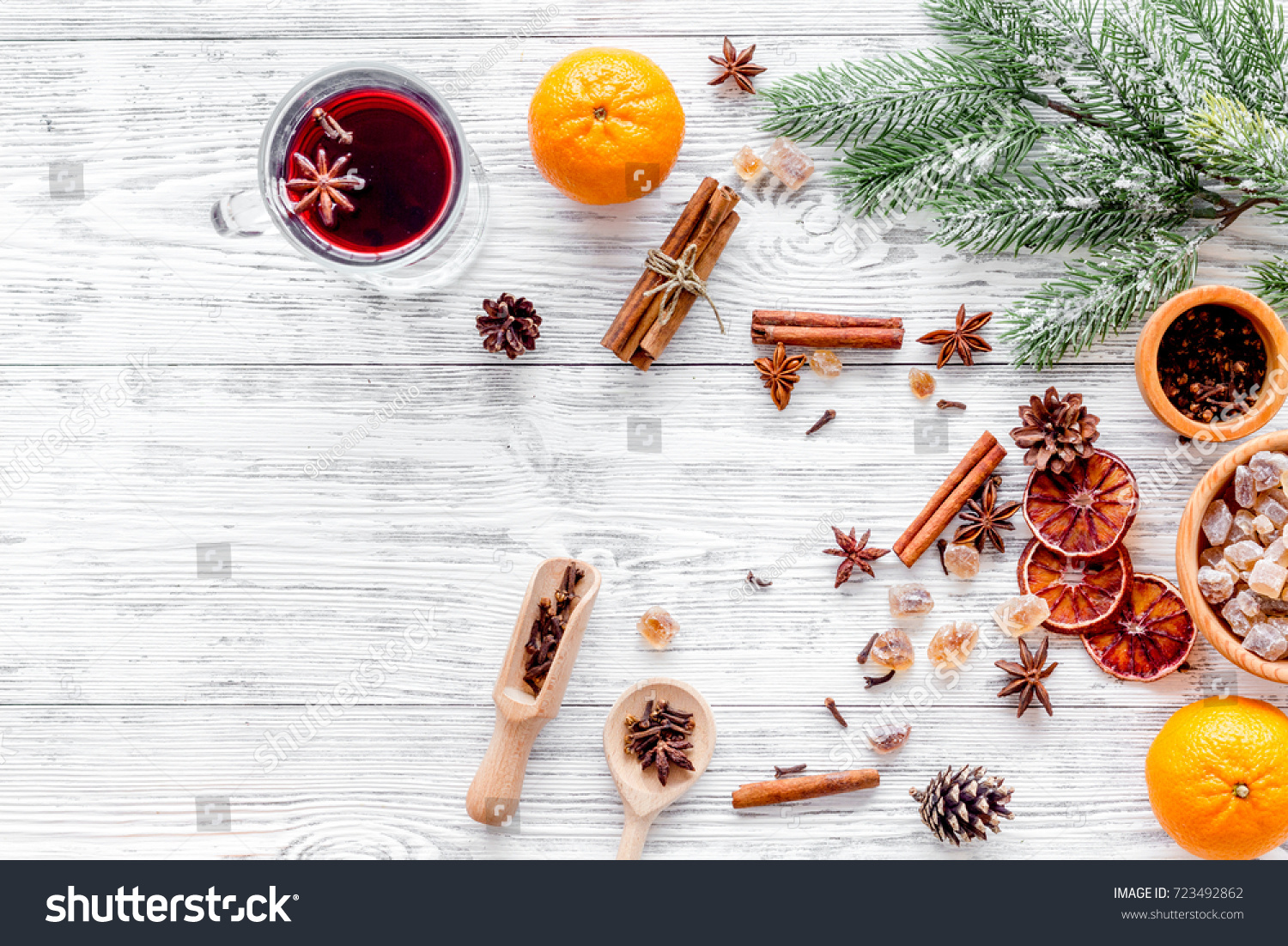 Merry christmas in winter evening with warm drink. Hot mulled wine or grog with fruits and spices on light background top view mock-up