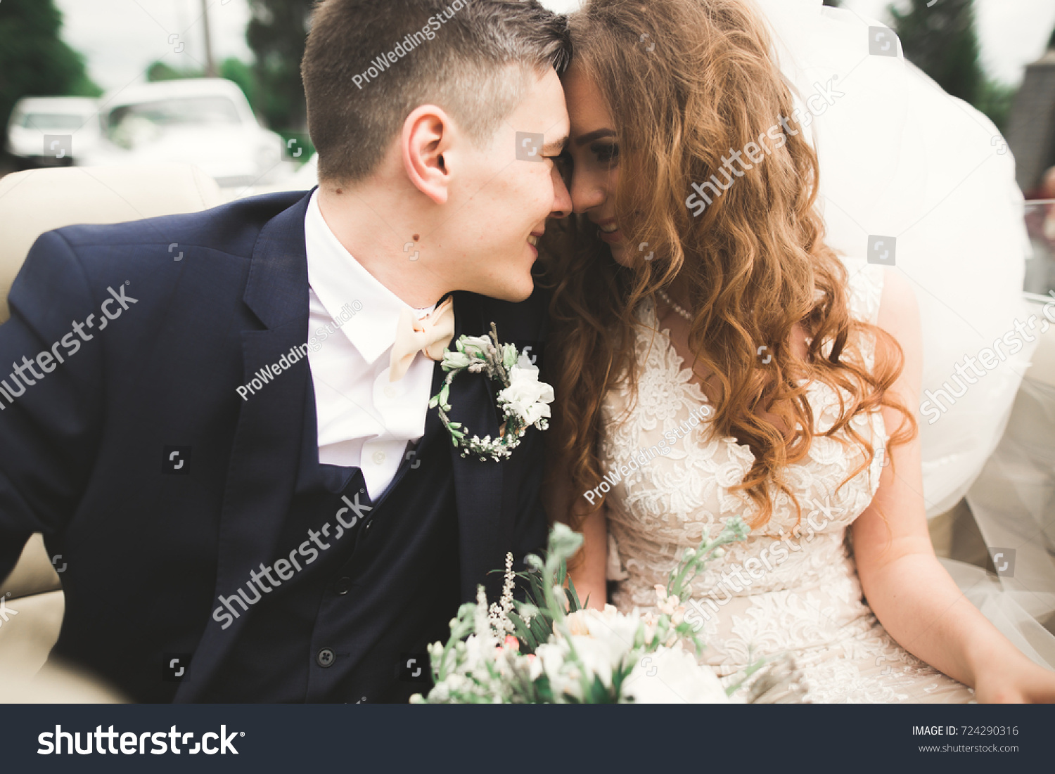 Happy bride and groom posing after wedding ceremony