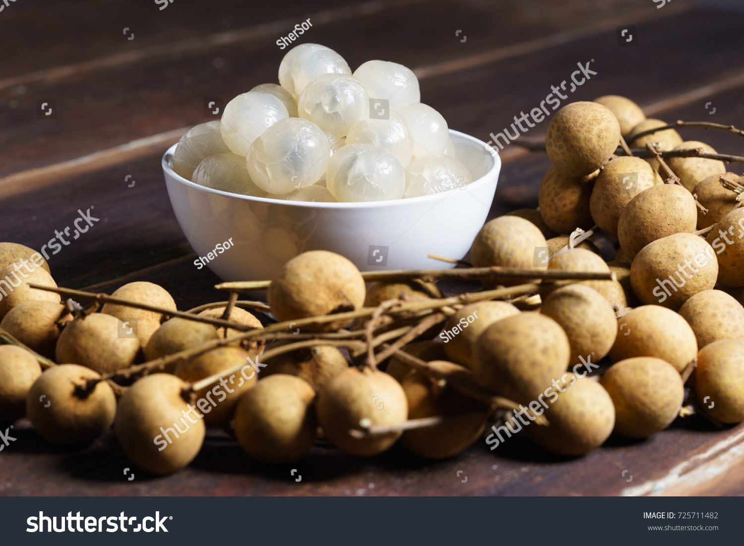 longan  exotic fruit  with peeled longan on wooden table