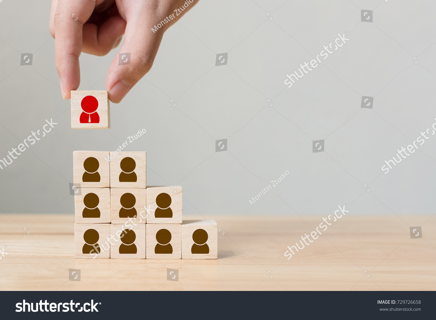 Human resource management and recruitment business concept  Hand putting wood cube block on top pyramid  Copy space