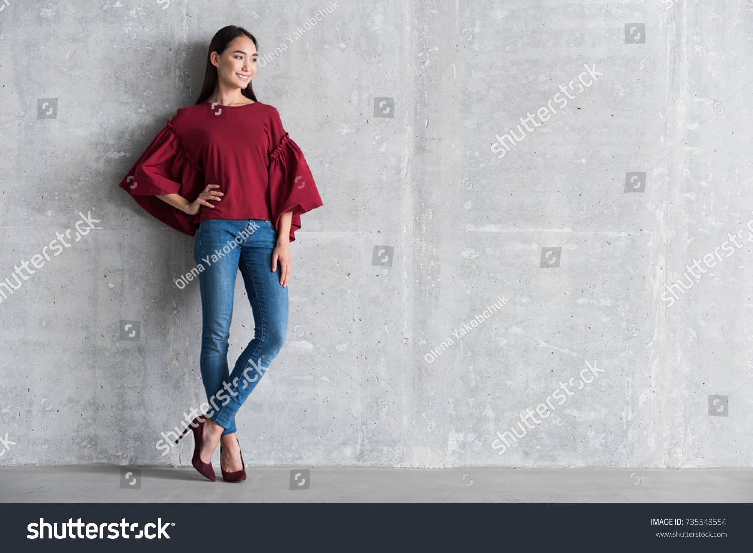 Pleasant elegant girl is standing in office