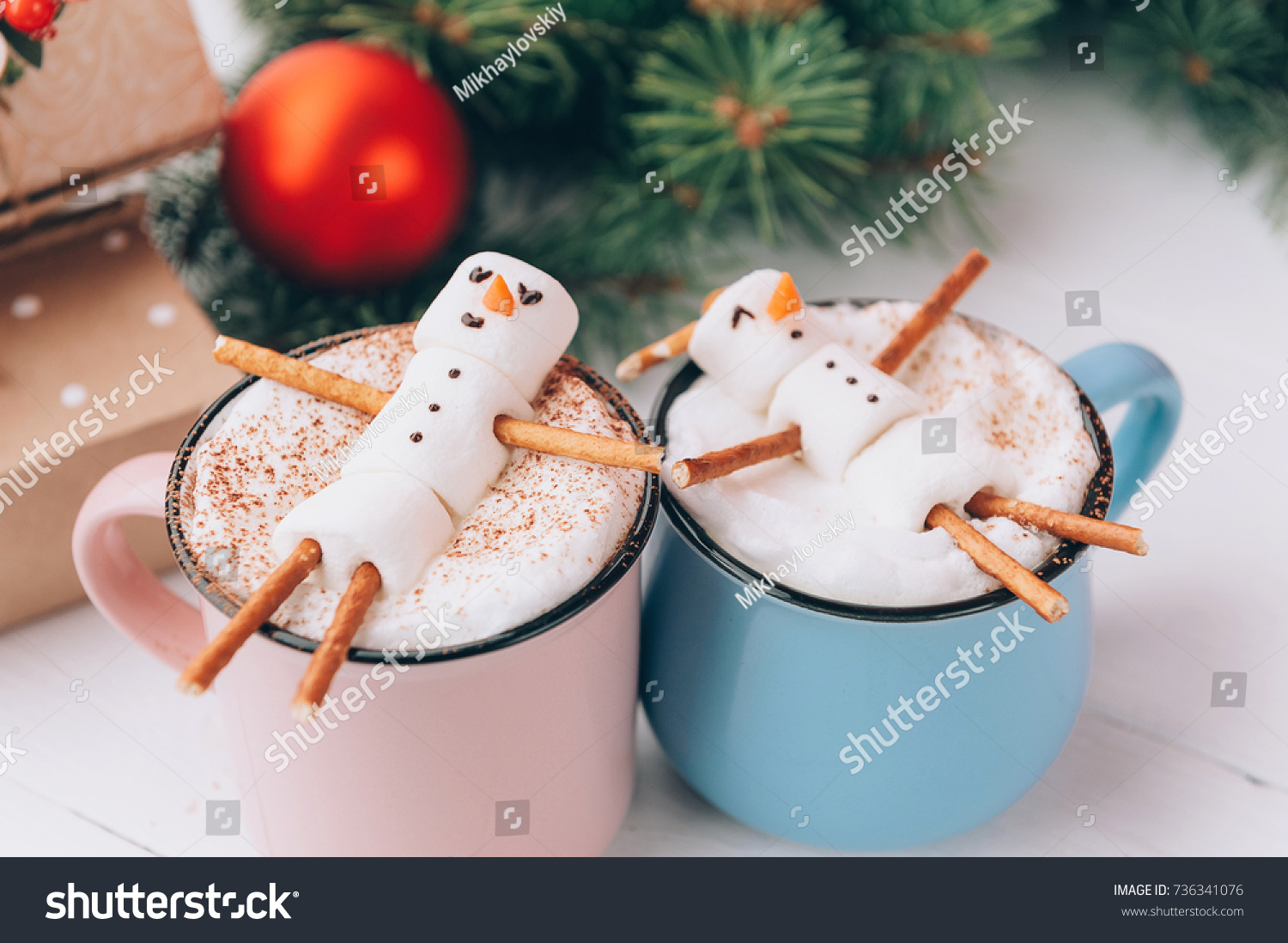 mugs with hot chocolate in which the men from the marshmallow relax. concept of a couple