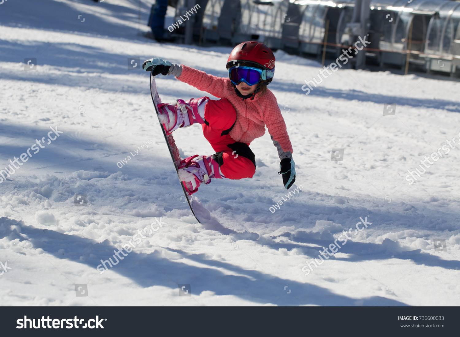 little girl snowboarding 