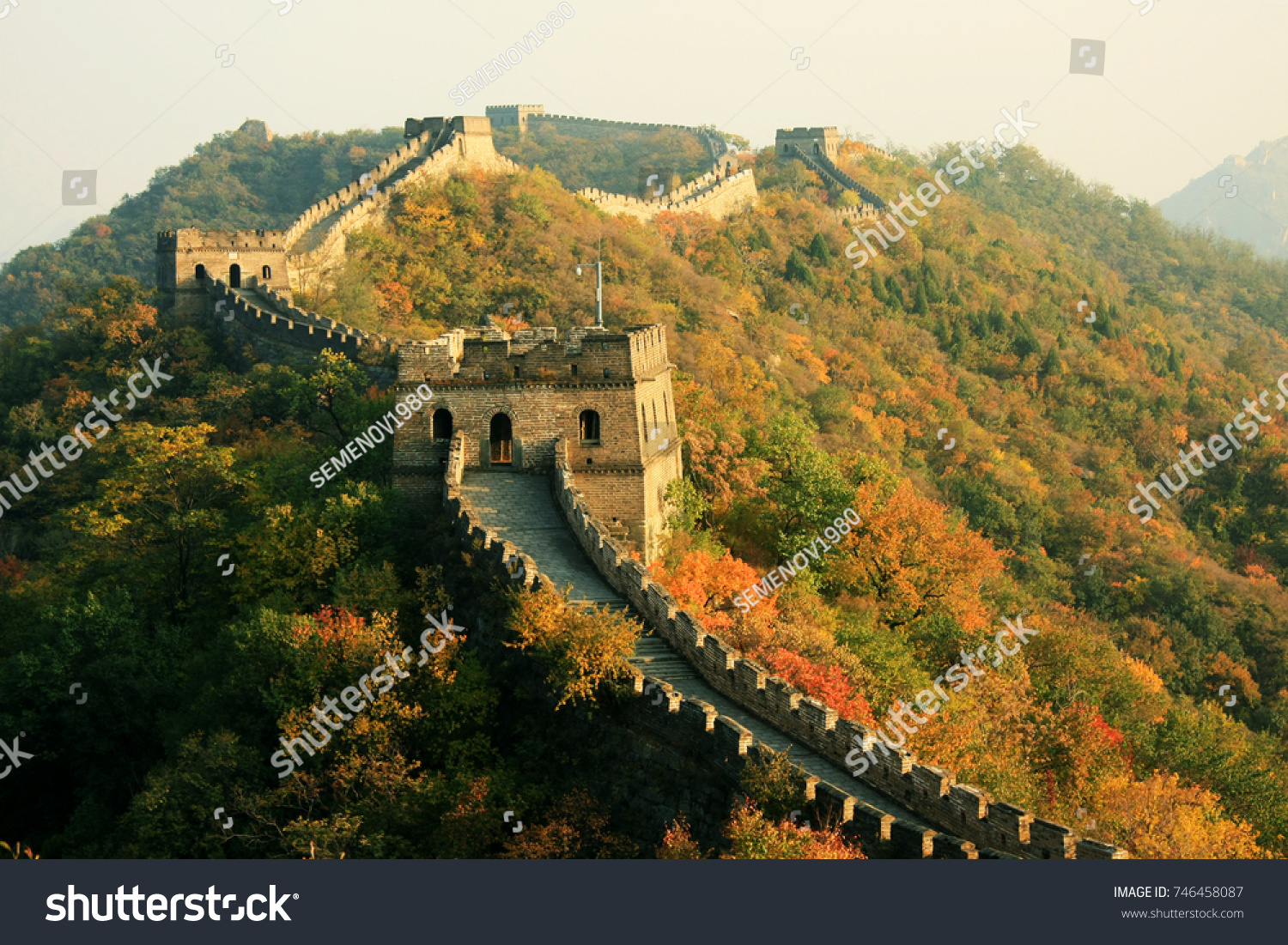 Wall in Autumn
China  Beijing: Great Wall in autumn. The section of the wall is Mutianyu. The wall passes along the crests of the hills  covered with wood.