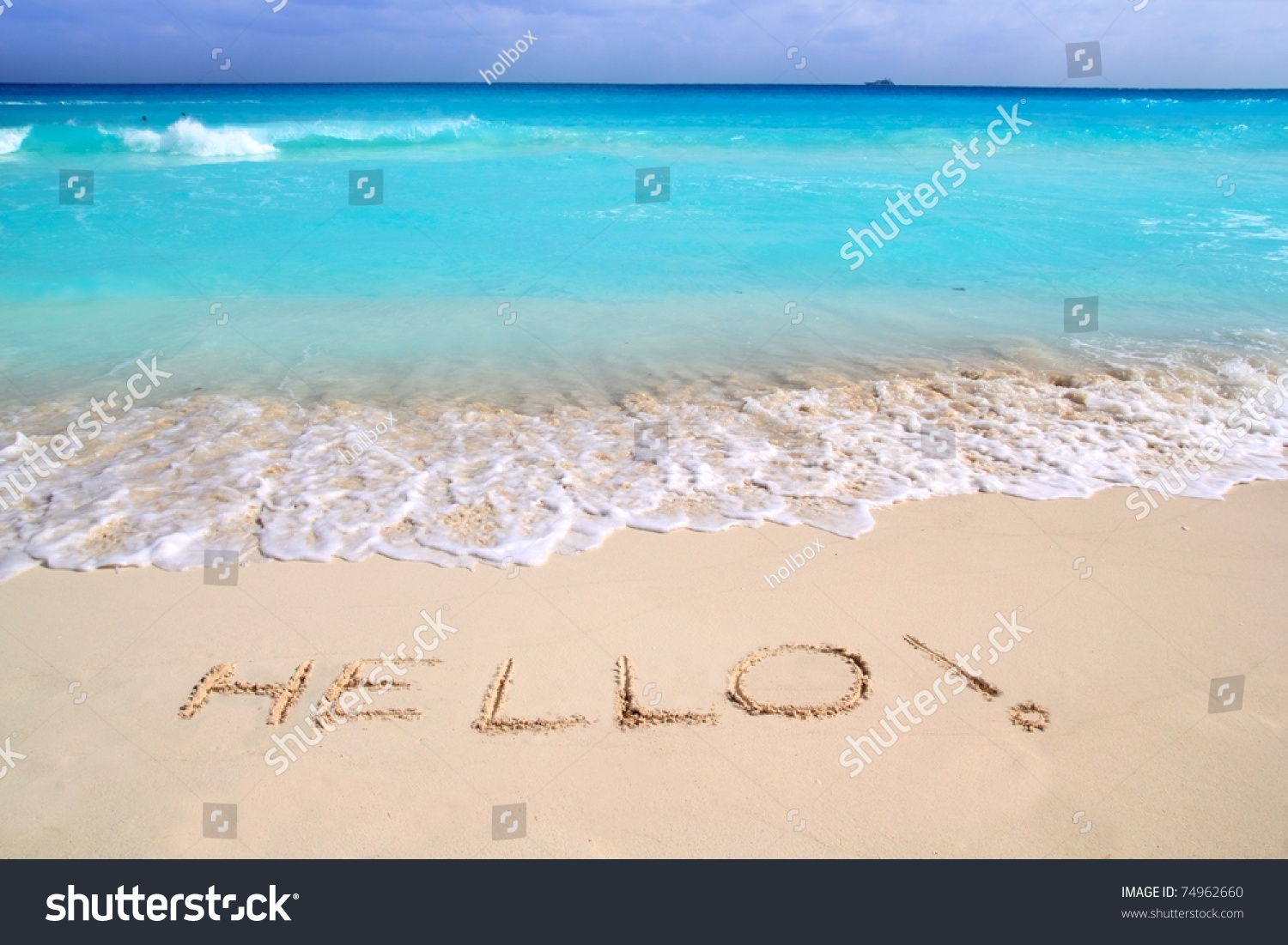 Hello message spell written in tropical beach sand Caribbean turquoise sea