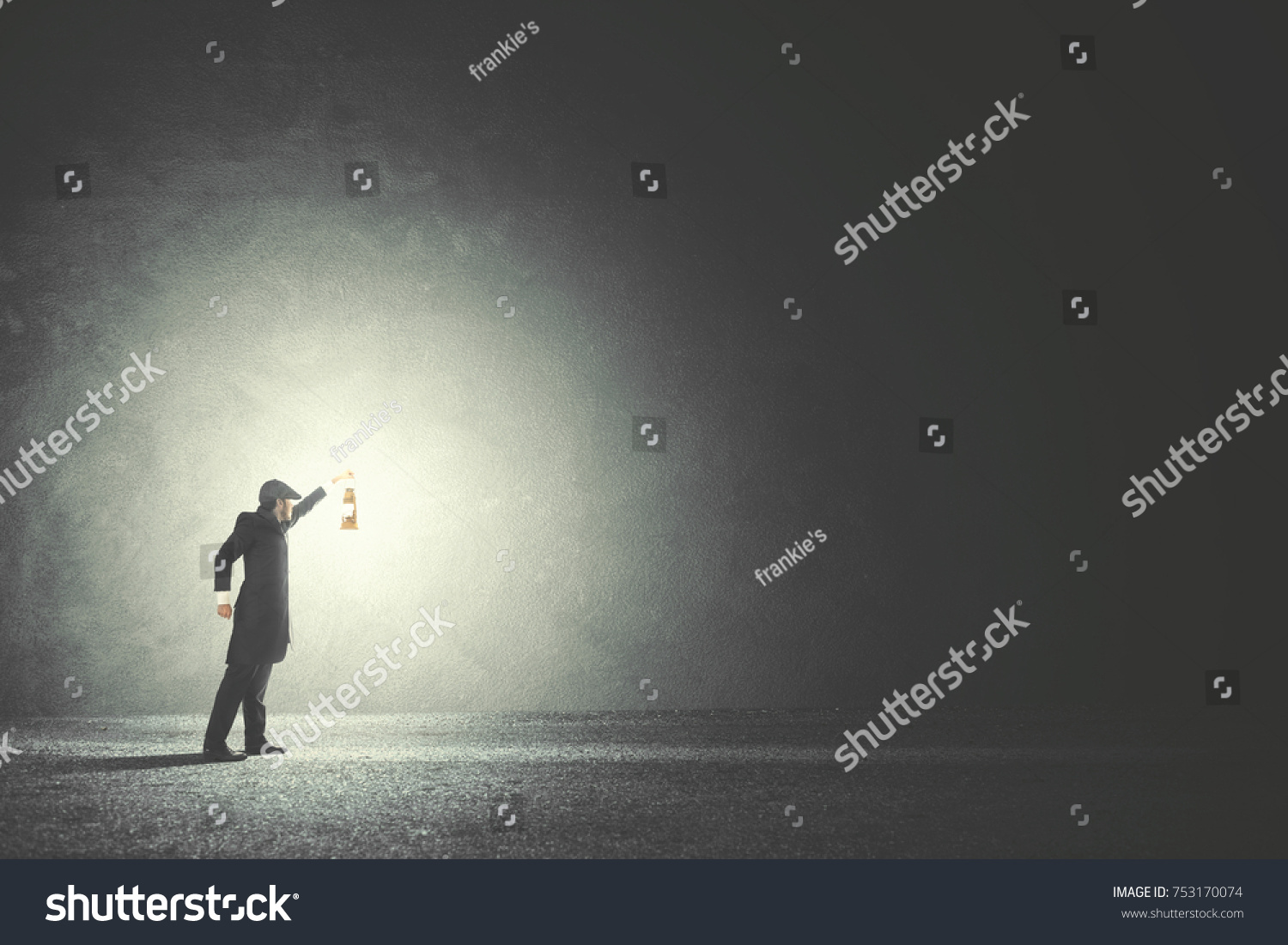 Man with lamp walking illuminating his path