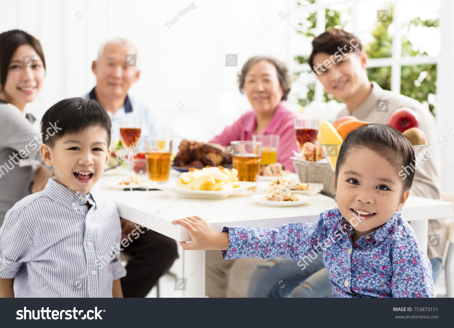 happy asian family having dinnerÂ at home
