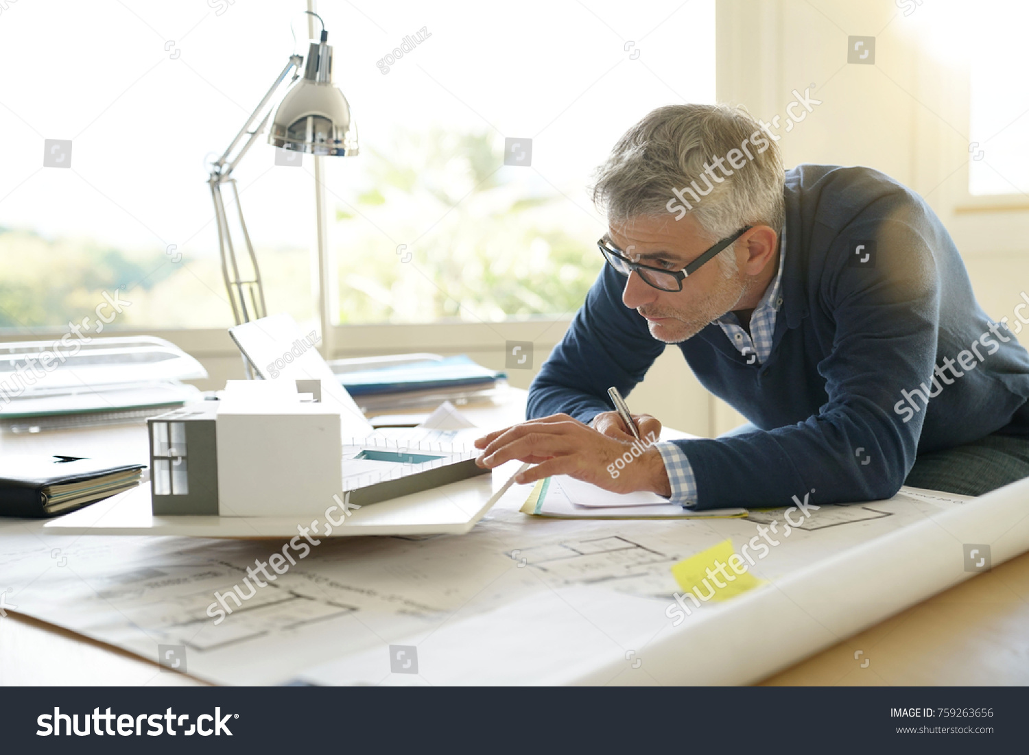 Architect in office working on 3D model