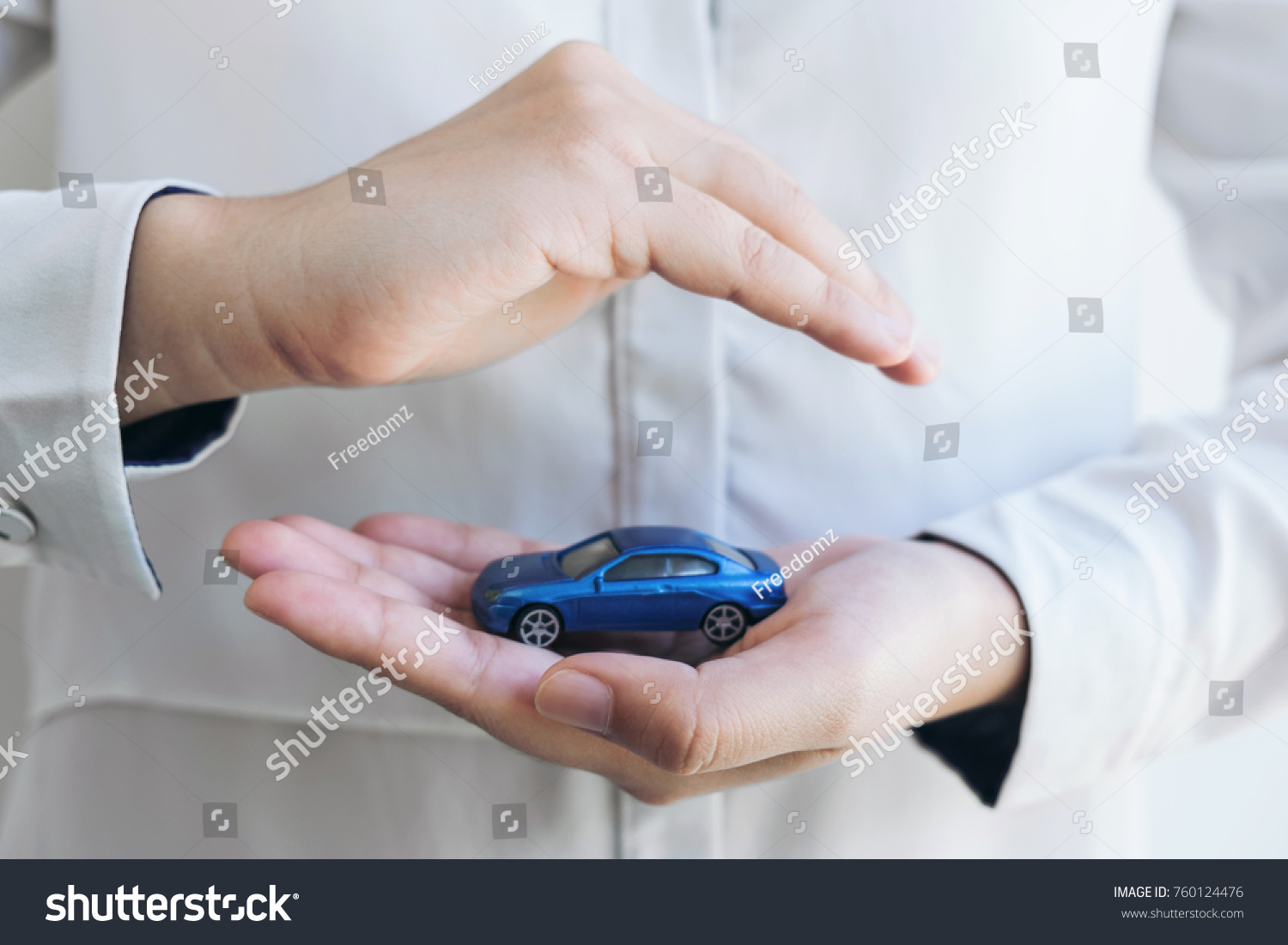 insurance and care protection of car concept  woman with protective gesture of blue car.
