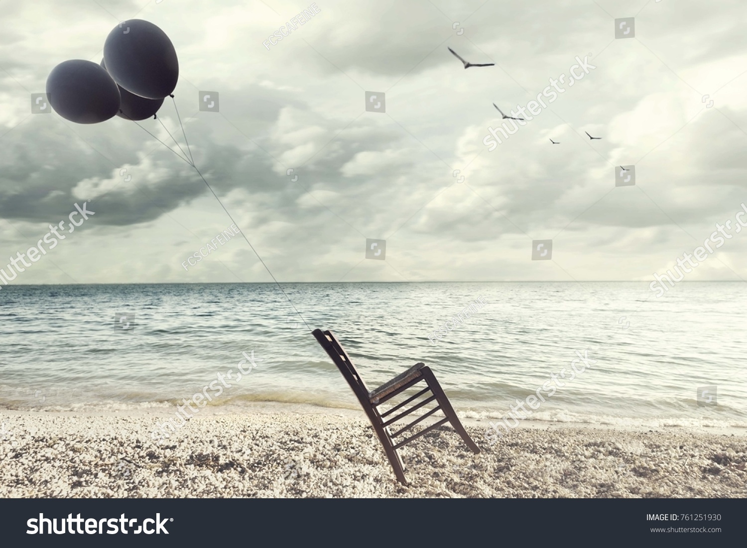 surreal image of a chair held in balance by flying balloons