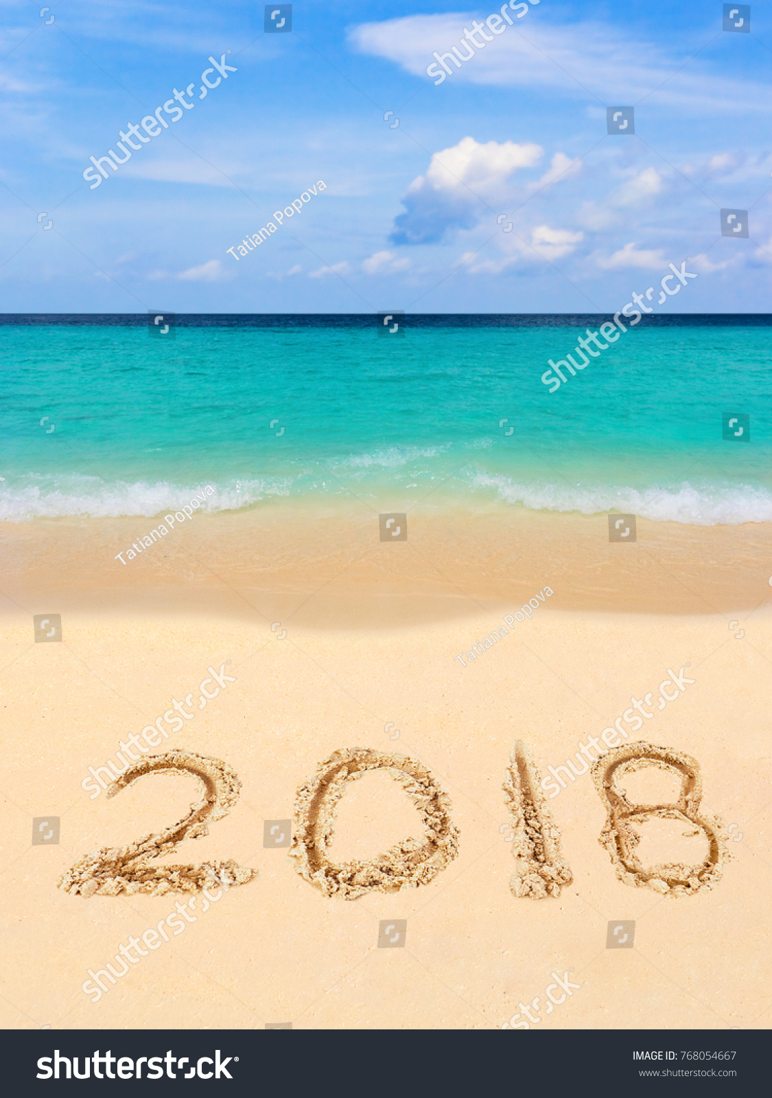 Numbers 2018 on beach - concept holiday background