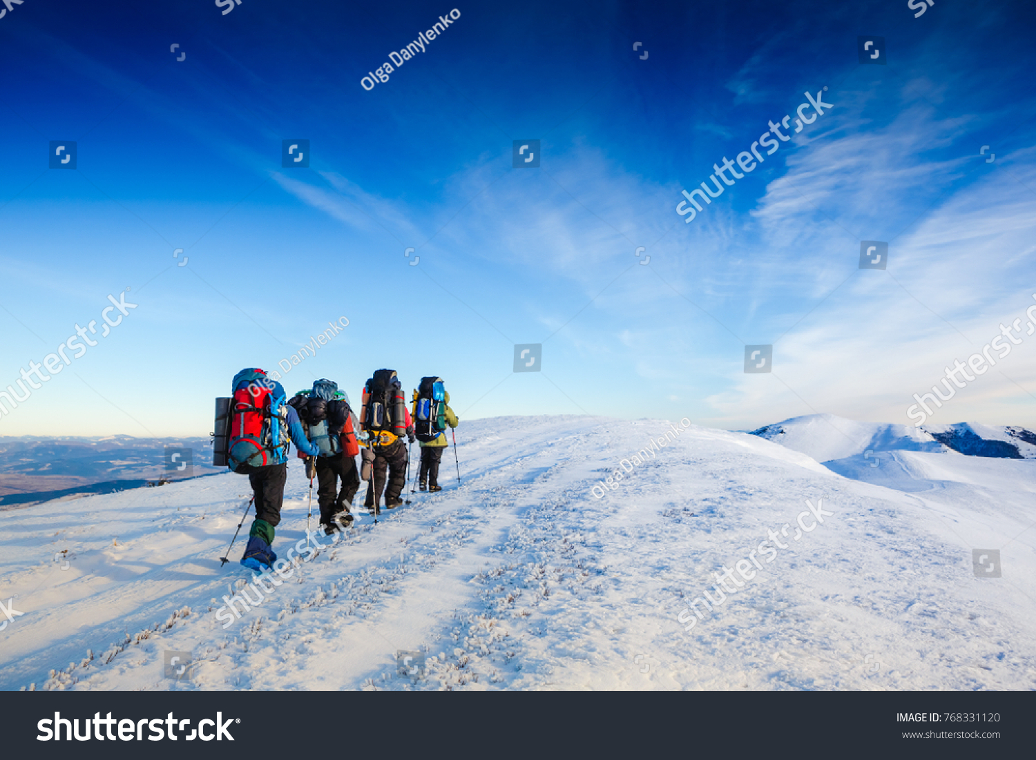 people hiking in beautiful winter mountains
