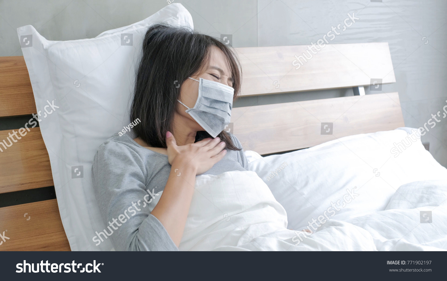woman get sick and fever lying on the bed