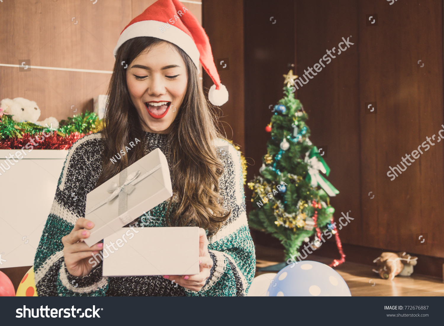 Asian woman in Christmas holiday party with gift