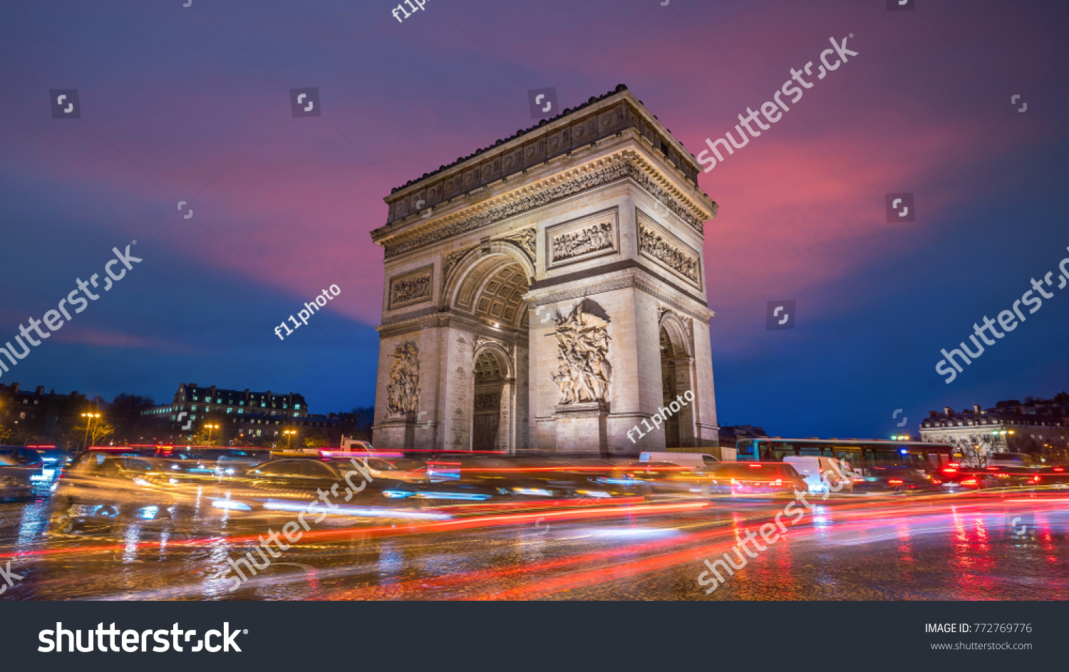 Famous Arc de Triomphe at twilight in Paris  France