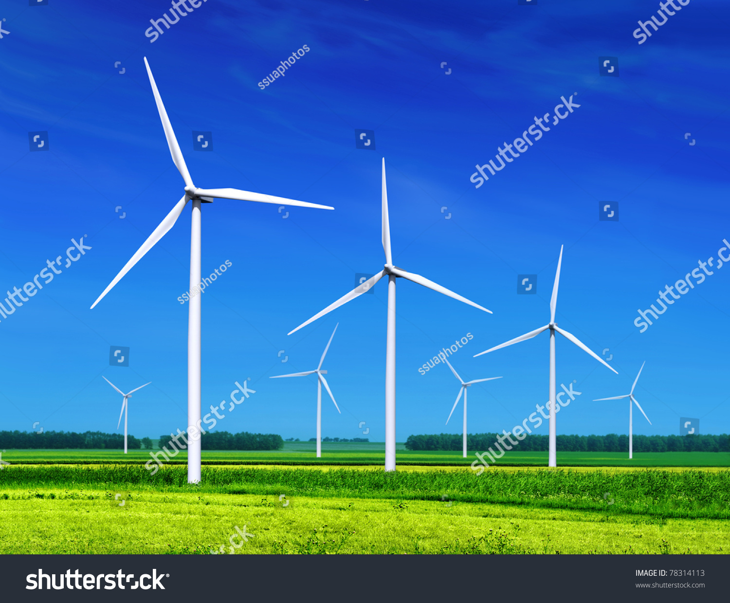 green meadow with Wind turbines generating electricity