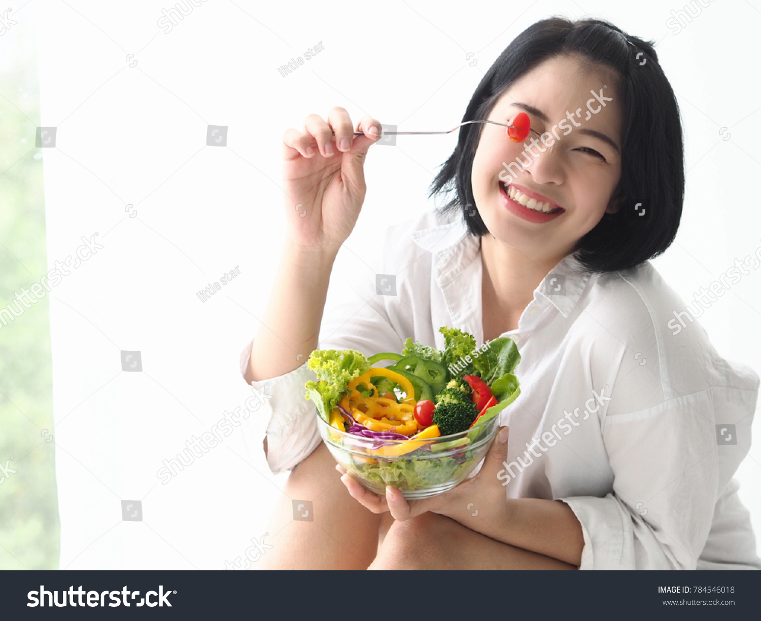 'Happy young Asian woman with fresh vegetable and fresh fruit healthy concept.